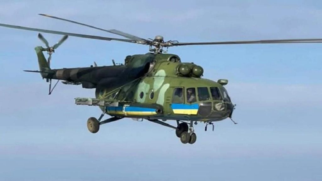 символічна сцена з шоломом, рукавицями та складеним прапором
