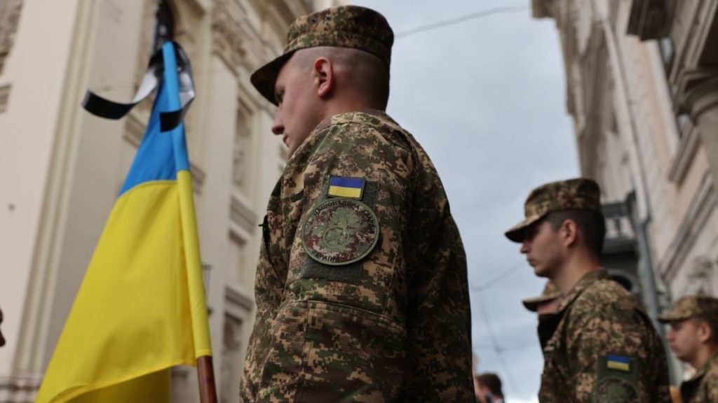 символічна сцена з відзнакою та свічкою, без осіб