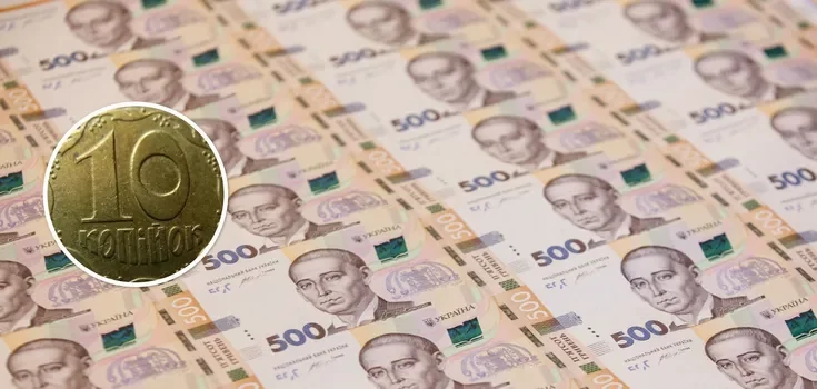символічна сцена з 10‑копійковою монетою та лупою на старому папері