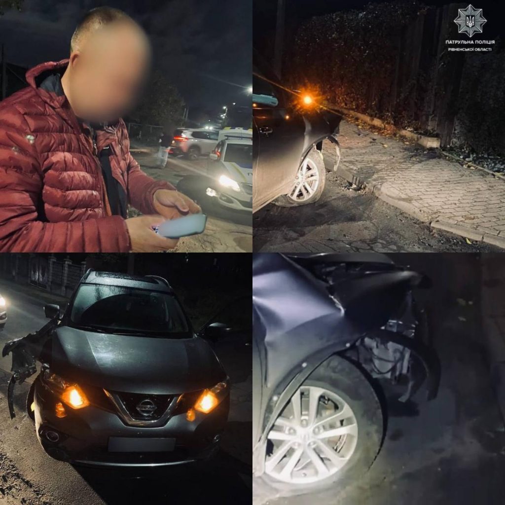 Евакуатор завантажує авто біля зігнутого металевого паркану на міській вулиці, без осіб.